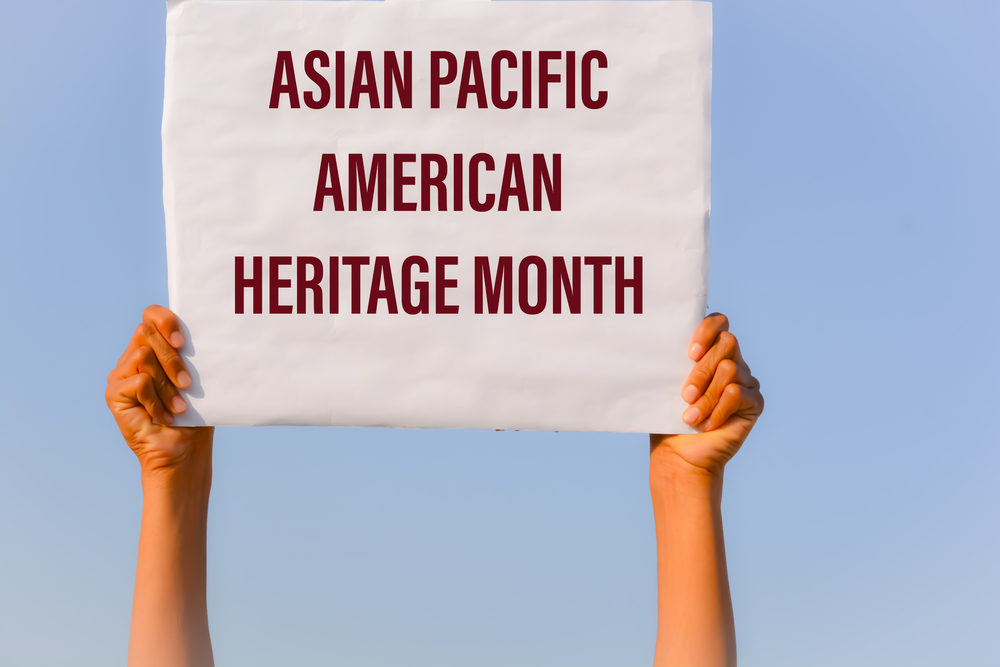 Asian,Pacific,American,Heritage,Month,With,Banner,In,Hand,In